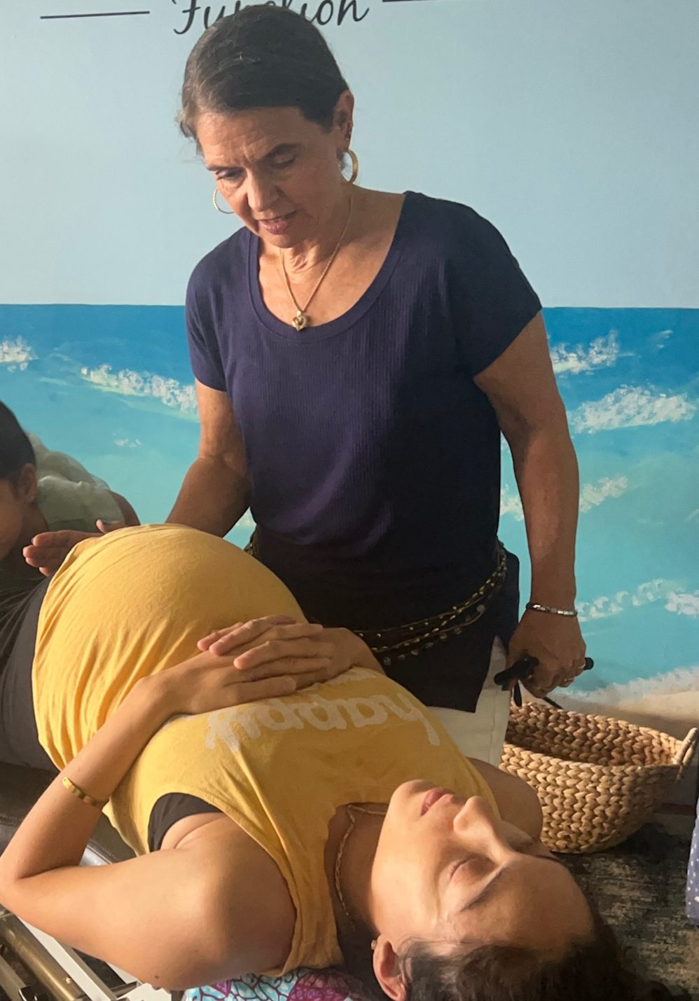 Pregnant woman lying on her side during a chiropractic adjustment