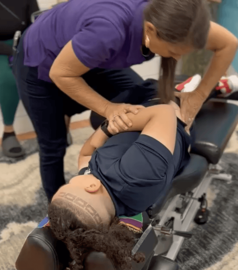 Child lying on their side during a chiropractic adjustment