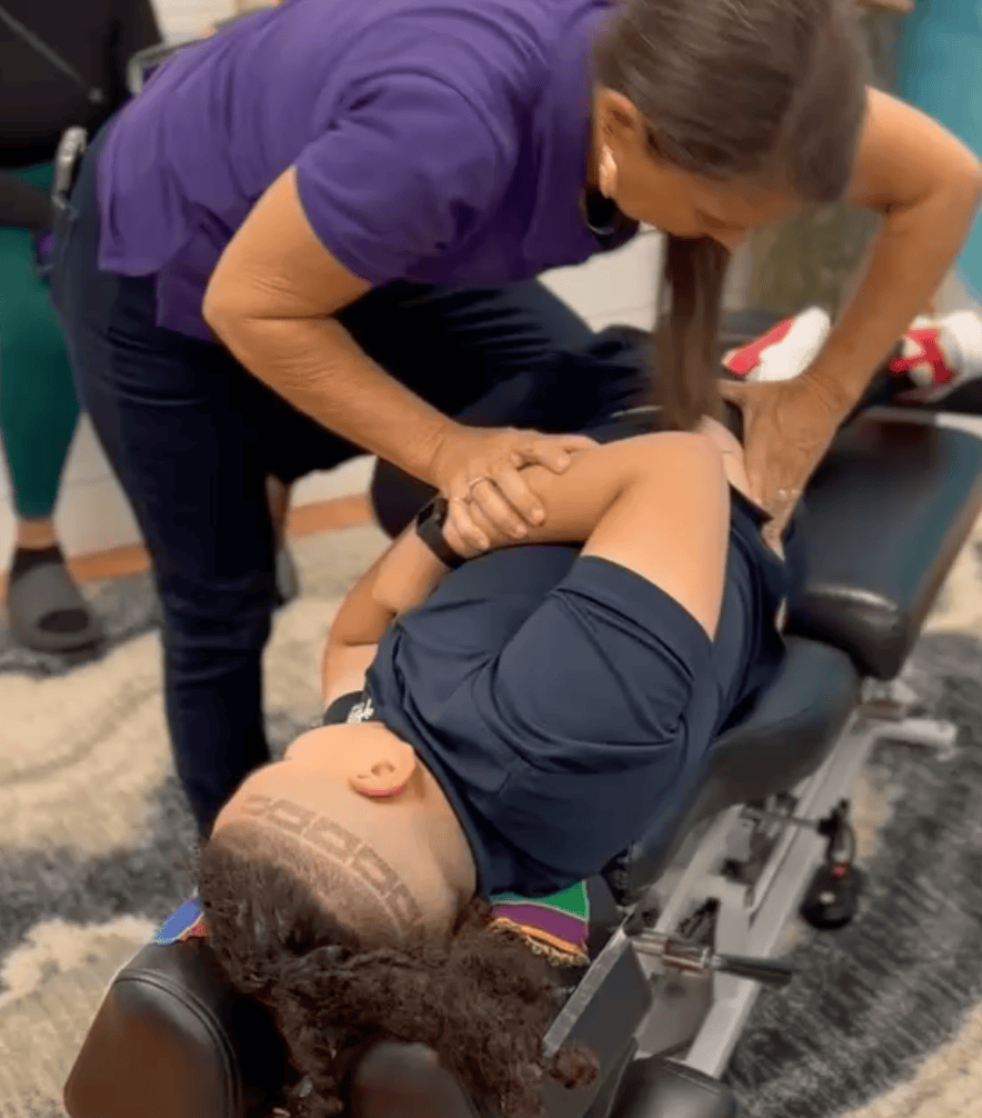 Child lying on their side during a chiropractic adjustment