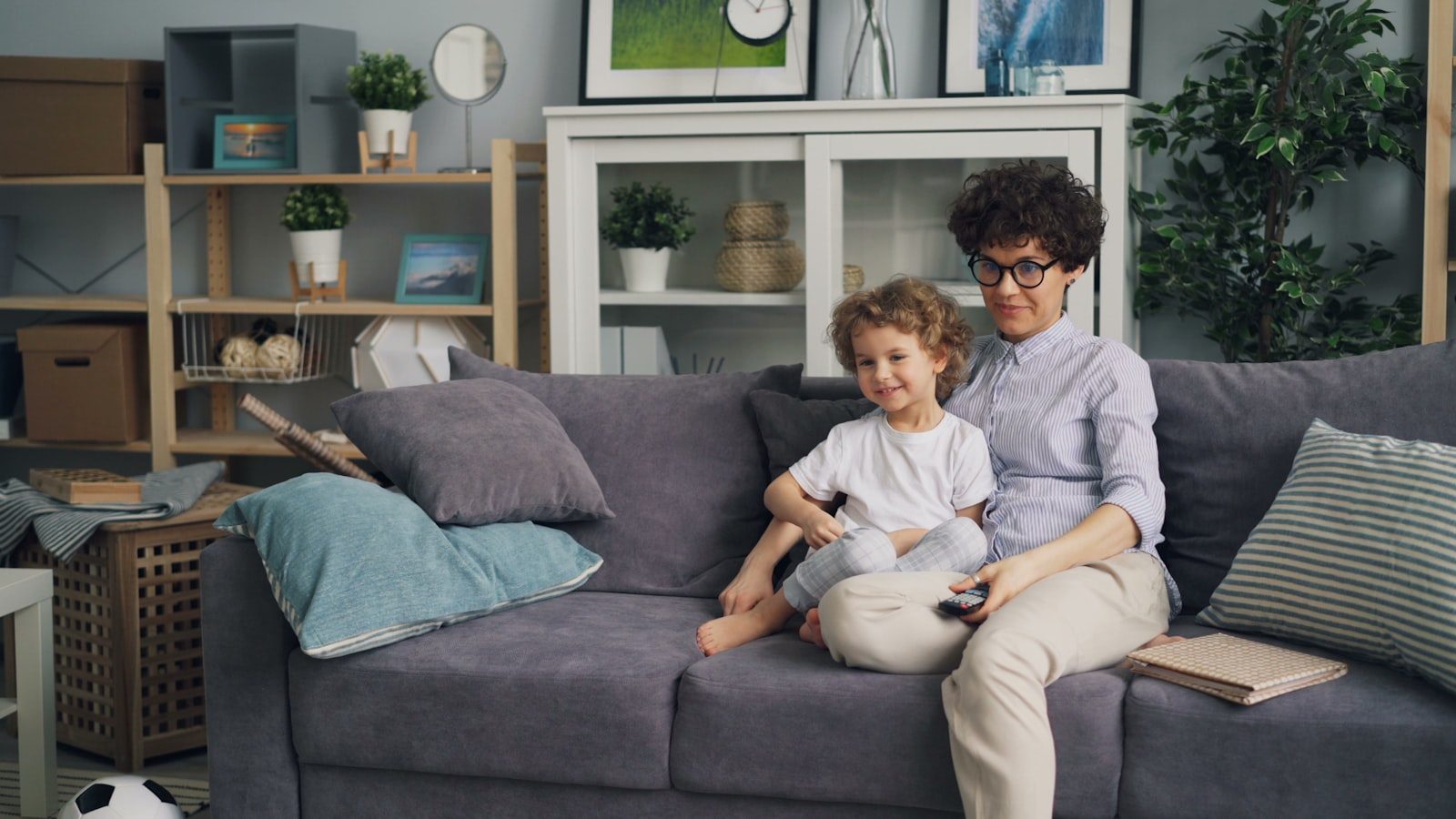 Parent and child relaxing together on a couch