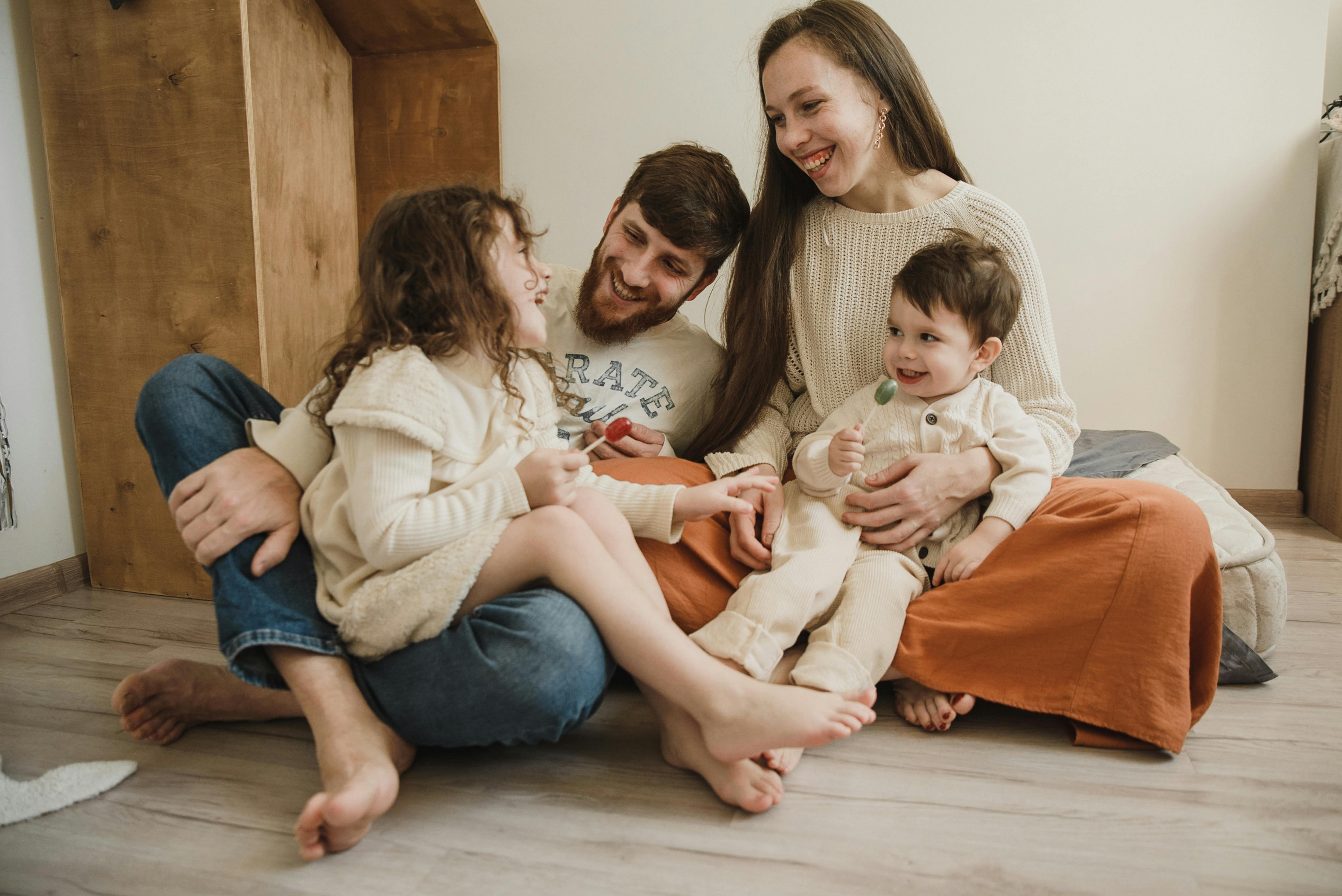 Happy family sitting on floor