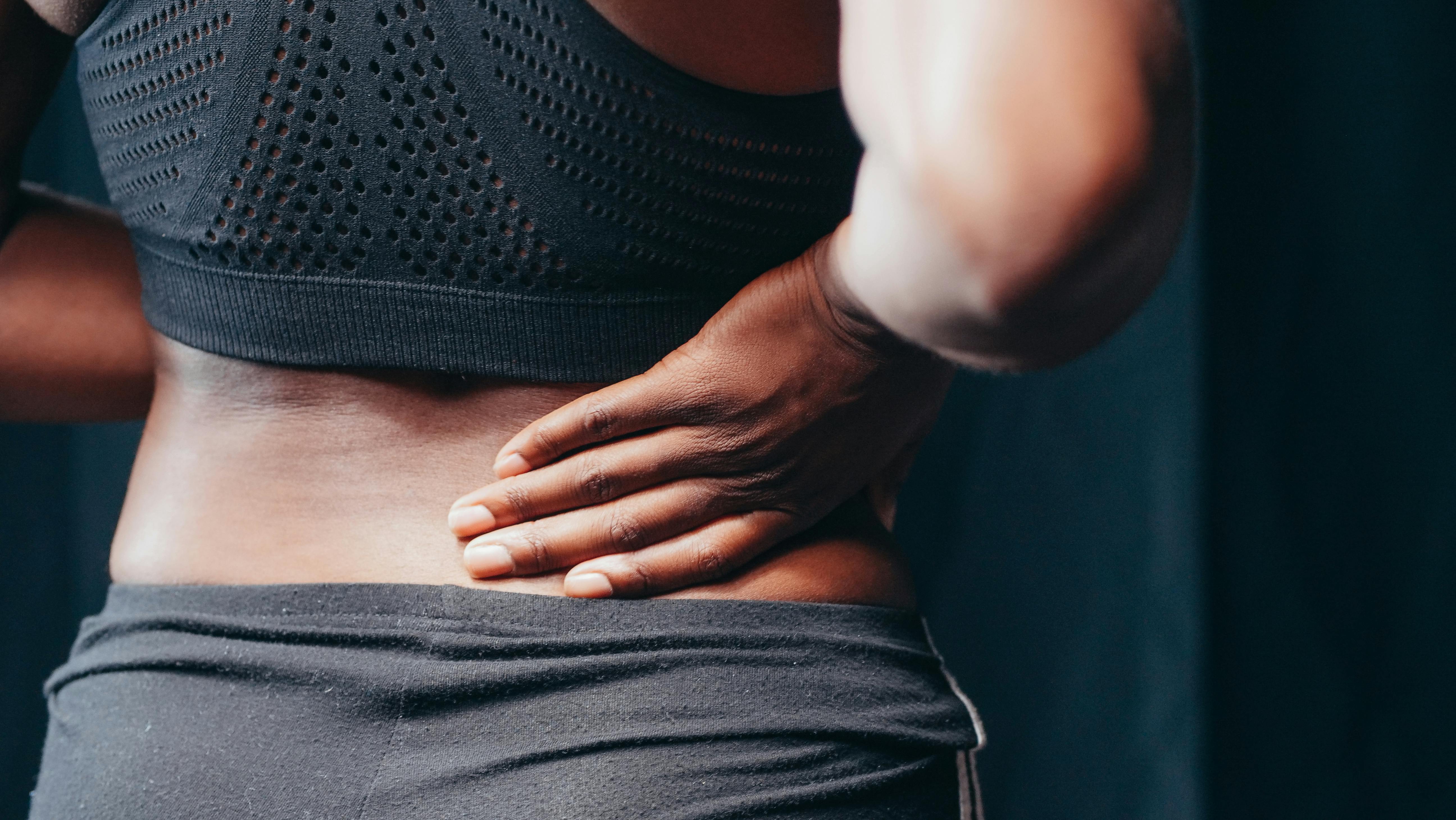 Woman touching back